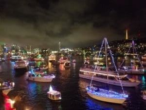 Parade of decorated boats in holiday formation